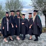 six of our FDLT graduates in gowns at Waterside Campus.